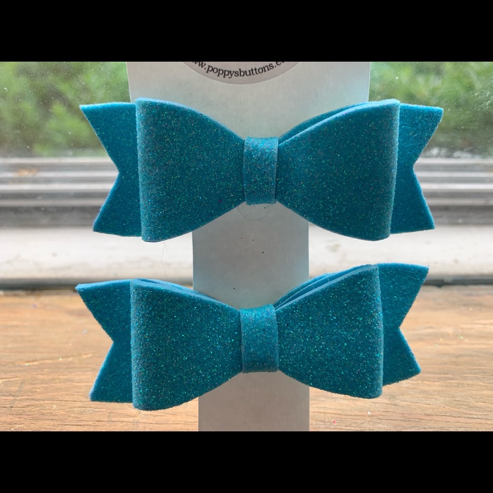 Pair of light blue hair bows